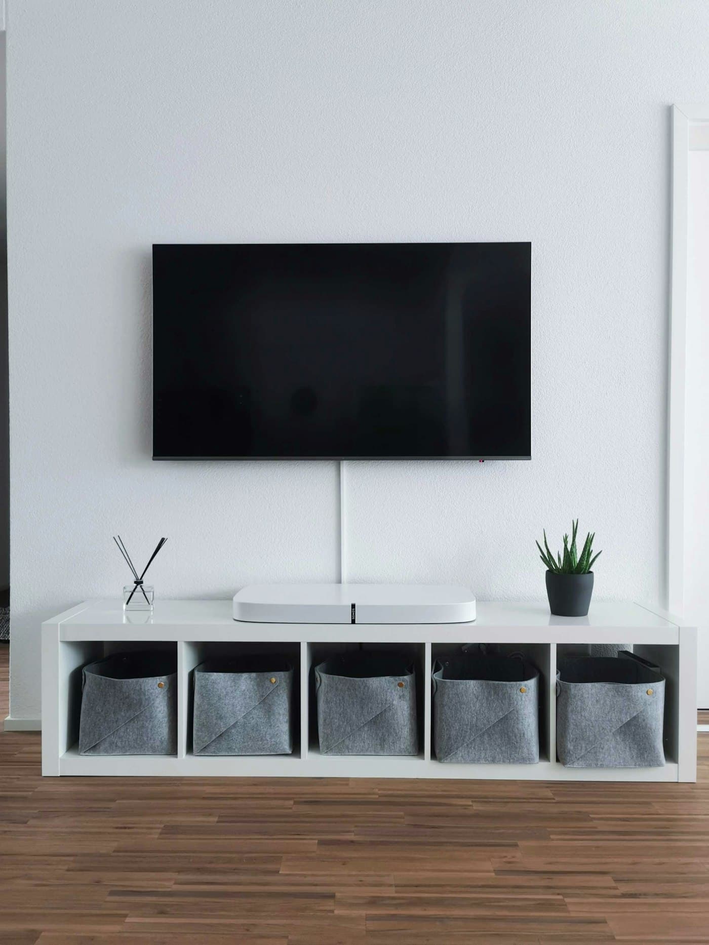 Minimalist wall-mounted smart TV setup, ready for Atlas TV installation